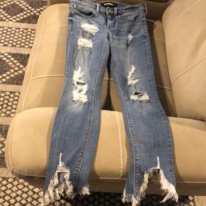 Express woman’s distressed jeans